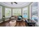 Relaxing sitting area with bay window overlooking the pool and backyard at 180 Keystone Palms Blvd, Tarpon Springs, FL 34688