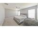 Comfortable bedroom with a king-size bed and large windows at 4424 Eternal Prince Dr, Ruskin, FL 33573