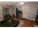 Living room with hardwood floors, gray walls, and a view into the kitchen at 319 N Jefferson Ave, Clearwater, FL 33755