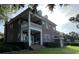 Brick house with a large porch and landscaping at 29731 Chapel Park Dr, Wesley Chapel, FL 33543