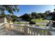 Back porch view of a quiet residential street with lush landscaping at 29731 Chapel Park Dr, Wesley Chapel, FL 33543
