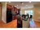 Updated kitchen features granite countertops, dark wood cabinets and a breakfast nook at 29731 Chapel Park Dr, Wesley Chapel, FL 33543