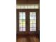 French doors open to a patio overlooking the backyard at 29731 Chapel Park Dr, Wesley Chapel, FL 33543