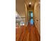Hardwood floored hallway with access to bedrooms at 29731 Chapel Park Dr, Wesley Chapel, FL 33543