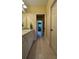 Clean bathroom with vanity, toilet, and access to bedroom at 29731 Chapel Park Dr, Wesley Chapel, FL 33543