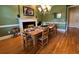 Formal dining room with hardwood floors and a rustic table at 29731 Chapel Park Dr, Wesley Chapel, FL 33543