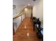 Upper level hallway with hardwood floors and storage at 29731 Chapel Park Dr, Wesley Chapel, FL 33543