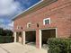 Three-car brick garage with attached storage at 29731 Chapel Park Dr, Wesley Chapel, FL 33543