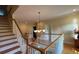 Upper hall showcasing hardwood floors and a grand staircase at 29731 Chapel Park Dr, Wesley Chapel, FL 33543
