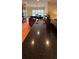 Large kitchen island with granite countertop, double sink, and views to the Gathering room at 29731 Chapel Park Dr, Wesley Chapel, FL 33543