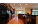 Gourmet kitchen with dark wood cabinets, granite counters and stainless steel appliances at 29731 Chapel Park Dr, Wesley Chapel, FL 33543
