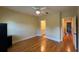 Bedroom with hardwood floors and en-suite bathroom at 29731 Chapel Park Dr, Wesley Chapel, FL 33543