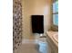 Simple bathroom with shower and polka dot curtain at 29731 Chapel Park Dr, Wesley Chapel, FL 33543
