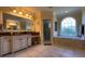 Elegant bathroom with soaking tub, walk-in shower, and large vanity at 29731 Chapel Park Dr, Wesley Chapel, FL 33543