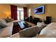 Relaxing living room with sectional sofa, large TV and access to backyard at 29731 Chapel Park Dr, Wesley Chapel, FL 33543