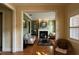 Cozy living room with a fireplace and hardwood floors at 29731 Chapel Park Dr, Wesley Chapel, FL 33543