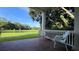 Brick porch overlooking a pond and green space at 29731 Chapel Park Dr, Wesley Chapel, FL 33543