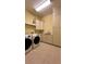 Laundry room with cabinets, sink, and washer/dryer at 29731 Chapel Park Dr, Wesley Chapel, FL 33543