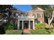 Brick two-story house with white columns and a balcony at 29731 Chapel Park Dr, Wesley Chapel, FL 33543