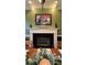 White fireplace in dining room with artwork above at 29731 Chapel Park Dr, Wesley Chapel, FL 33543