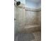 Large walk-in shower with tiled walls and seat at 29731 Chapel Park Dr, Wesley Chapel, FL 33543