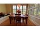Charming breakfast nook with a wooden table and built-in bench seating at 29731 Chapel Park Dr, Wesley Chapel, FL 33543