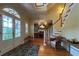 Bright entryway with hardwood floors, staircase and double doors at 29731 Chapel Park Dr, Wesley Chapel, FL 33543