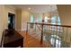 Upstairs hallway with hardwood floors and access to bedrooms at 29731 Chapel Park Dr, Wesley Chapel, FL 33543