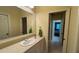 Bathroom with vanity, tiled floor and access to bedroom at 29731 Chapel Park Dr, Wesley Chapel, FL 33543
