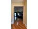 Spacious main bedroom with hardwood floors and access to a balcony at 29731 Chapel Park Dr, Wesley Chapel, FL 33543