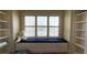 Cozy window seat with built-in shelves and window at 29731 Chapel Park Dr, Wesley Chapel, FL 33543