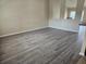 Spacious living room with attractive hard wood floors and natural light at 12161 Cavern Rd, Spring Hill, FL 34609