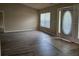 Inviting living room showcasing wood floors, neutral paint, and bright natural light at 12161 Cavern Rd, Spring Hill, FL 34609