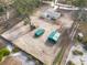 Aerial view of a house with detached sheds on a large lot at 38545 Burger Ln, Dade City, FL 33523