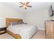 Bedroom with wood headboard and striped bedding at 13804 Meadow Oaks Dr, Dover, FL 33527