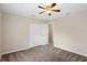 Bedroom with double door closet and ceiling fan at 12161 Cavern Rd, Spring Hill, FL 34609