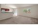 Living room features carpet and an open floor plan at 12161 Cavern Rd, Spring Hill, FL 34609