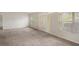 Living room with carpeted floor and neutral walls at 12161 Cavern Rd, Spring Hill, FL 34609