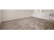 Spacious living room with neutral-toned carpet at 12161 Cavern Rd, Spring Hill, FL 34609