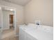 Laundry room with washer, dryer, and access to bathroom at 12161 Cavern Rd, Spring Hill, FL 34609