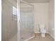 Bathroom with shower stall, toilet and tile flooring at 12161 Cavern Rd, Spring Hill, FL 34609