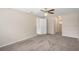 Primary bedroom with carpet and access to bathroom and closet at 12161 Cavern Rd, Spring Hill, FL 34609