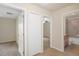 Hallway with doors to bedrooms and a bathroom at 12161 Cavern Rd, Spring Hill, FL 34609