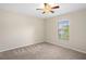 Bedroom with carpet, window, and ceiling fan at 12161 Cavern Rd, Spring Hill, FL 34609