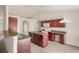 Well-equipped kitchen with dark wood cabinets and tile floors at 12161 Cavern Rd, Spring Hill, FL 34609