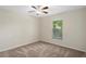 Bright bedroom with carpeted floor and ceiling fan at 12161 Cavern Rd, Spring Hill, FL 34609