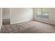 Bright bedroom with carpet flooring and large window at 12161 Cavern Rd, Spring Hill, FL 34609