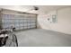 Garage with space for car and storage, featuring an automatic garage door opener at 12161 Cavern Rd, Spring Hill, FL 34609