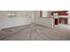 Open living room and kitchen area with carpet flooring at 12161 Cavern Rd, Spring Hill, FL 34609