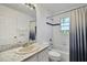 Clean bathroom with a tub shower and marble countertop at 1122 Vinetree Dr, Brandon, FL 33510